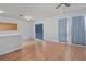 The spacious living room with wood floors has lots of natural light at 814 Fern Leaf Dr, Ruskin, FL 33570