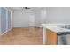 Spacious living room with wood floors connected to a kitchen at 814 Fern Leaf Dr, Ruskin, FL 33570
