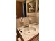 Compact bathroom featuring a vanity sink, mirror, and a classic tiled countertop at 5915 18Th N St # 12, St Petersburg, FL 33714