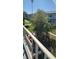 Balcony view of the apartment complex with green space and trees at 5915 18Th N St # 12, St Petersburg, FL 33714