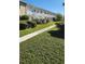The apartment building is surrounded by lush landscaping and greenery, creating a serene living environment at 5915 18Th N St # 12, St Petersburg, FL 33714