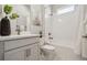Bright bathroom showcasing white tiles in the shower, complemented by modern fixtures and decor at 6123 Hidden Branch Dr, Apollo Beach, FL 33572