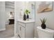 Stylish bathroom with a gray vanity, modern decor, and wood-look flooring, creating a welcoming atmosphere at 6123 Hidden Branch Dr, Apollo Beach, FL 33572