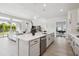 Spacious kitchen island with quartz countertops and stainless steel dishwasher at 6123 Hidden Branch Dr, Apollo Beach, FL 33572