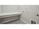 The laundry room has a folding counter, patterned floors, and a rack at 6123 Hidden Branch Dr, Apollo Beach, FL 33572