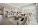 Spacious living room open to kitchen features modern gray color palette and plenty of room to entertain at 6123 Hidden Branch Dr, Apollo Beach, FL 33572