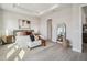Spacious main bedroom with a tray ceiling, modern decor, and plenty of natural light at 6123 Hidden Branch Dr, Apollo Beach, FL 33572