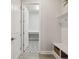 The entrance of mudroom has a nice bench, coat rack, and eye-catching tile flooring at 6123 Hidden Branch Dr, Apollo Beach, FL 33572