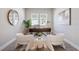 Cozy home office with two large windows, stylish decor, and plenty of natural light at 6123 Hidden Branch Dr, Apollo Beach, FL 33572