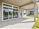 A large patio offers a great outdoor living space with a bright neutral color at 6123 Hidden Branch Dr, Apollo Beach, FL 33572