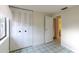 Bright bedroom featuring a spacious closet, neutral walls, and easy access to the ensuite bathroom at 102 Shoreview Ln, Oldsmar, FL 34677