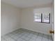 Bedroom featuring clean tile floors, neutral walls, and a large window offering lots of natural light at 102 Shoreview Ln, Oldsmar, FL 34677