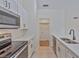 This newly updated kitchen features stainless appliances and crisp white cabinets at 102 Shoreview Ln, Oldsmar, FL 34677