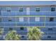 Exterior shot of multiple balconies with white railings on the building at 18325 Gulf Blvd # 407, Redington Shores, FL 33708