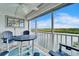 Balcony featuring a dining table with Adirondack chairs and fantastic waterfront views at 18325 Gulf Blvd # 407, Redington Shores, FL 33708