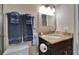 Cozy bathroom featuring granite-topped vanity, chrome fixtures and soft, neutral tones at 18325 Gulf Blvd # 407, Redington Shores, FL 33708