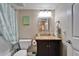 Bathroom with granite vanity, framed mirror, and tub with curtain at 18325 Gulf Blvd # 407, Redington Shores, FL 33708