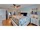Lovely bedroom featuring side tables with lamps, nautical decorations, and ensuite bathroom access at 18325 Gulf Blvd # 407, Redington Shores, FL 33708