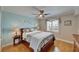 Cozy bedroom featuring a ceiling fan, seaside decor, a wooden bed frame and bright lighting at 18325 Gulf Blvd # 407, Redington Shores, FL 33708