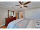 Comfortable bedroom with a large dresser, mirror, and a calming nautical-themed design at 18325 Gulf Blvd # 407, Redington Shores, FL 33708