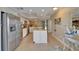 Bright kitchen featuring white cabinets, granite countertops, and stainless steel appliances at 18325 Gulf Blvd # 407, Redington Shores, FL 33708