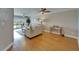 Bright living room with hardwood flooring and access to the balcony at 18325 Gulf Blvd # 407, Redington Shores, FL 33708