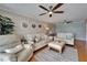 Comfortable living room with ceiling fan, neutral decor, plush seating, and bright lighting at 18325 Gulf Blvd # 407, Redington Shores, FL 33708