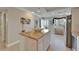 Bright open living room with decor, tile floors, and sliding glass doors to a balcony at 18325 Gulf Blvd # 407, Redington Shores, FL 33708