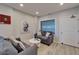 Cozy lobby area with comfortable seating and a decorative art piece at 18325 Gulf Blvd # 407, Redington Shores, FL 33708
