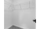 White walk-in closet with wire shelving and neutral carpet; ideal for storage at 4546 Padgette St, North Port, FL 34291