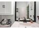 Well-maintained bathroom features modern sink and fixtures, and updated design, offering a clean and comfortable space at 5215 New Brittany Ln, Zephyrhills, FL 33541