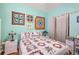 Comfortable bedroom with decorative quilts and pillows, providing a cozy and inviting atmosphere at 5215 New Brittany Ln, Zephyrhills, FL 33541