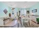 Inviting dining area with stylish decor and ample seating, perfect for entertaining guests in this home at 5215 New Brittany Ln, Zephyrhills, FL 33541