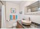 Bathroom includes granite counters, an undermount sink and a shower with decorative accents at 8829 Bay Pointe Dr # 205, Tampa, FL 33615