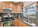 Updated kitchen features granite countertops, stainless steel appliances, and a water view at 8829 Bay Pointe Dr # 205, Tampa, FL 33615
