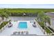 Community pool area features ample seating, tables, and views of water at 8829 Bay Pointe Dr # 205, Tampa, FL 33615
