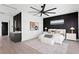 Well-lit primary bedroom with decorative accents, modern fan and elegant design at 17059 Dolphin Dr, North Redington Beach, FL 33708