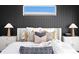 Close-up of primary bedroom with stylish decor, comfortable bedding, and soft lighting at 17059 Dolphin Dr, North Redington Beach, FL 33708