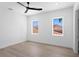 Bright and airy bedroom with neutral tones, hardwood floors, and natural light at 17059 Dolphin Dr, North Redington Beach, FL 33708