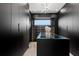 Spacious walk-in closet with custom shelving, cabinets, and ample storage space at 17059 Dolphin Dr, North Redington Beach, FL 33708