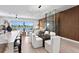 Open concept living area featuring water views, modern lighting, and sophisticated decor at 17059 Dolphin Dr, North Redington Beach, FL 33708