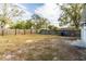 A large fenced-in backyard with grass and trees at 3721 9Th S Ave, St Petersburg, FL 33711