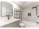 Modern bathroom features a sleek vanity, black fixtures, and tiled shower and tub at 3721 9Th S Ave, St Petersburg, FL 33711
