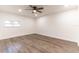 Light filled bedroom boasts wood-look floors, recessed lighting, and a ceiling fan at 3721 9Th S Ave, St Petersburg, FL 33711