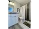 Renovated bathroom features granite vanity, shower with modern black and grey accent tiles at 4684 25Th S Ave, St Petersburg, FL 33711