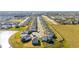 Wide aerial shot of a new construction community with multiple homes and ponds in the background at 7815 Bronze Oak Dr, Wesley Chapel, FL 33545