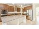 Spacious kitchen with stainless steel appliances, granite counters, and ample cabinet storage at 7815 Bronze Oak Dr, Wesley Chapel, FL 33545