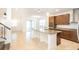 Modern, open-concept kitchen featuring a large island, stainless steel appliances, and granite countertops at 7815 Bronze Oak Dr, Wesley Chapel, FL 33545