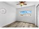 Bright bedroom featuring a ceiling fan, window with natural light, and closet at 8716 Hickorywood Ln, Tampa, FL 33615