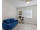 Bright bedroom with natural light, featuring a workspace and comfortable seating, perfect for relaxation or work at 8716 Hickorywood Ln, Tampa, FL 33615
